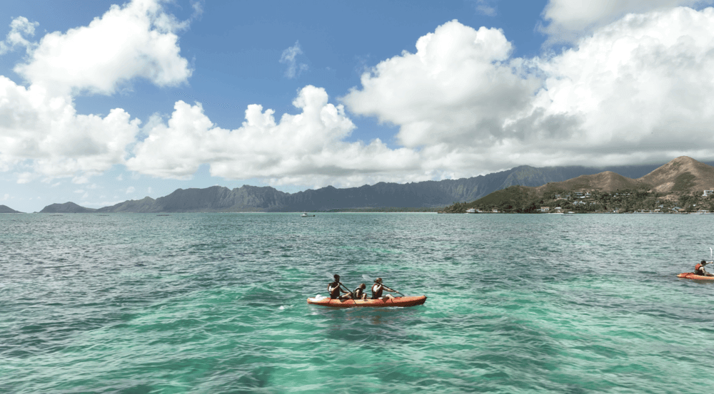 two people in a kayak rental from Active Oahu paddling to the Mokulua Islands
